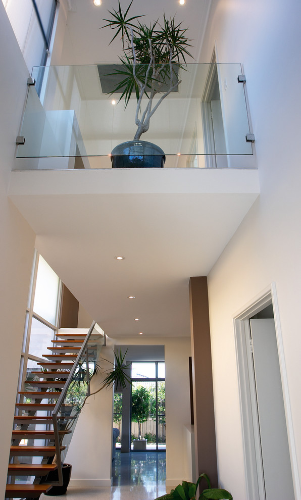 Example of a trendy concrete floor hallway design in Perth with white walls