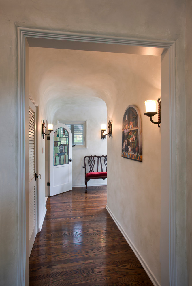 Inspiration for a mid-sized mediterranean medium tone wood floor hallway remodel in Los Angeles