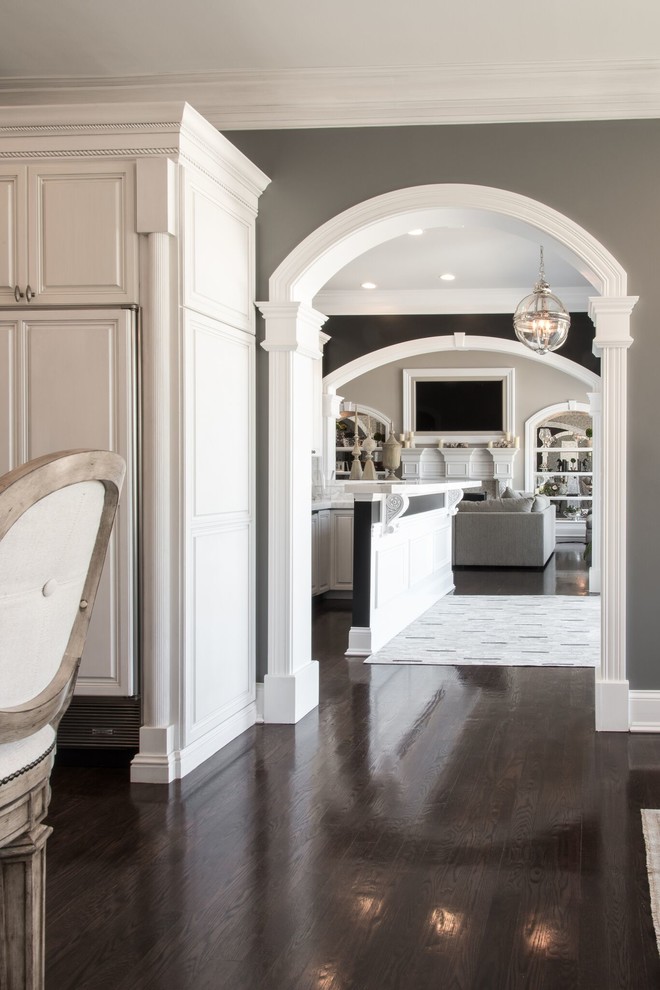 Inspiration for a large timeless dark wood floor hallway remodel in St Louis with gray walls