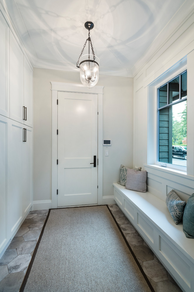 Mid-sized elegant porcelain tile and gray floor hallway photo in Vancouver with gray walls