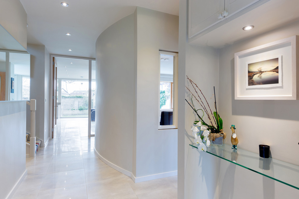 Large trendy porcelain tile hallway photo in Dublin with gray walls