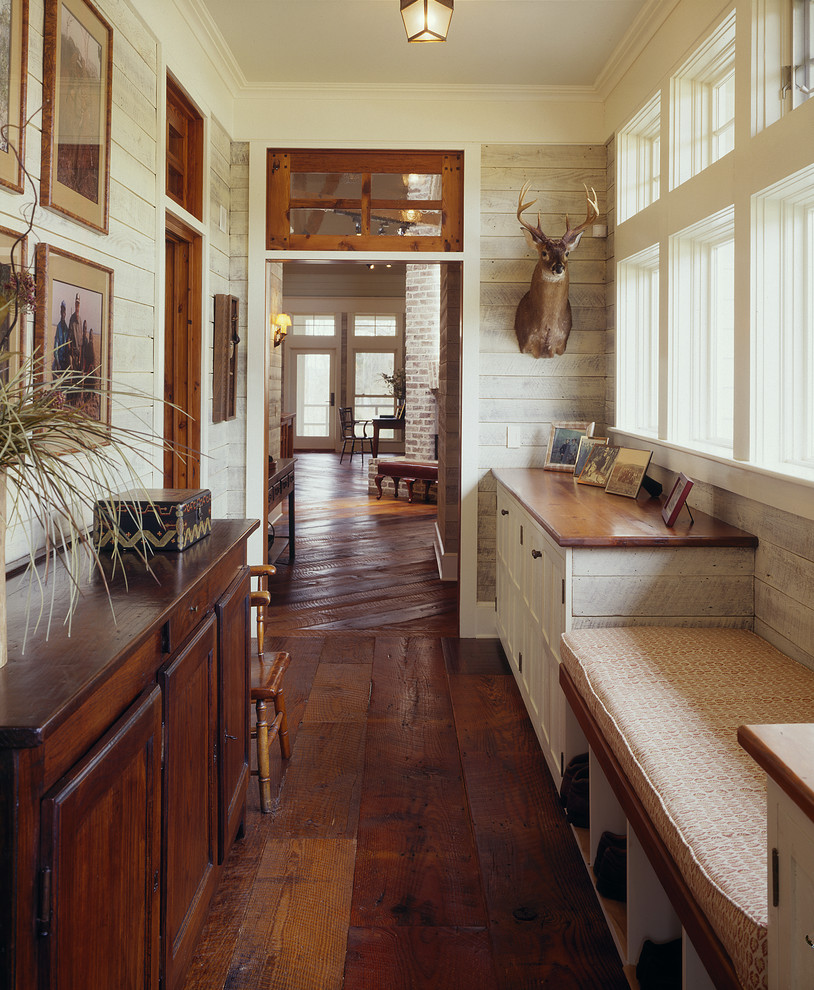 Inspiration for a mid-sized cottage dark wood floor hallway remodel in Atlanta with white walls