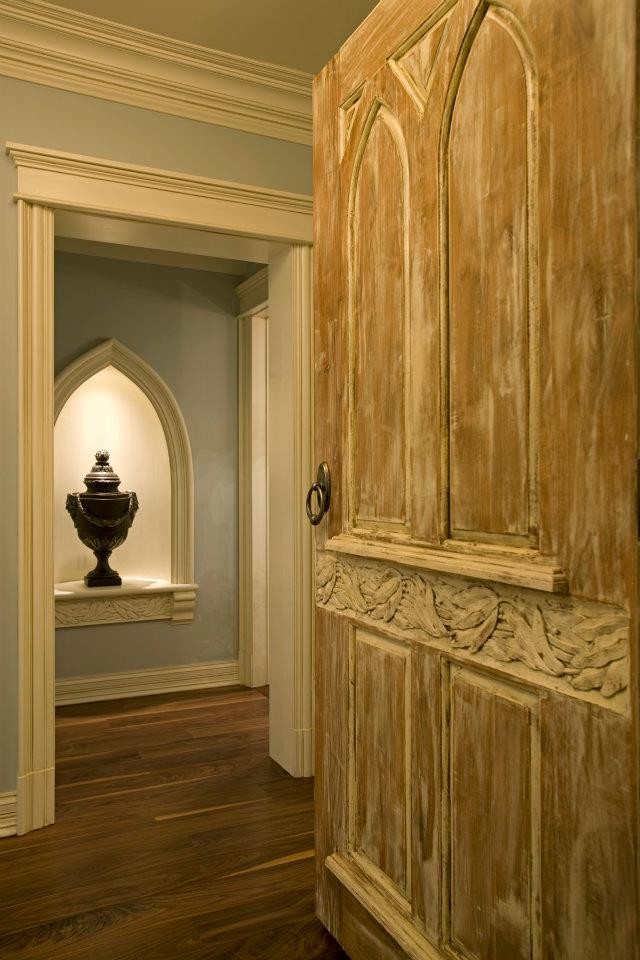 Mid-sized elegant medium tone wood floor hallway photo in Chicago with gray walls