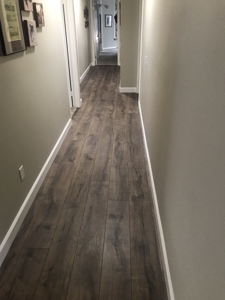 Hallway - mid-sized contemporary vinyl floor and gray floor hallway idea in San Diego with gray walls