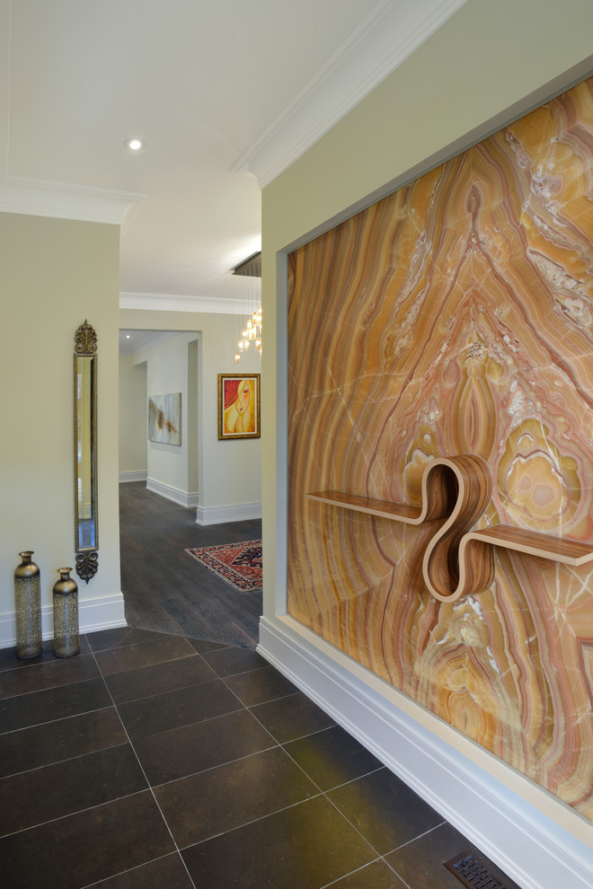 Example of a mid-sized trendy slate floor hallway design in Toronto with beige walls