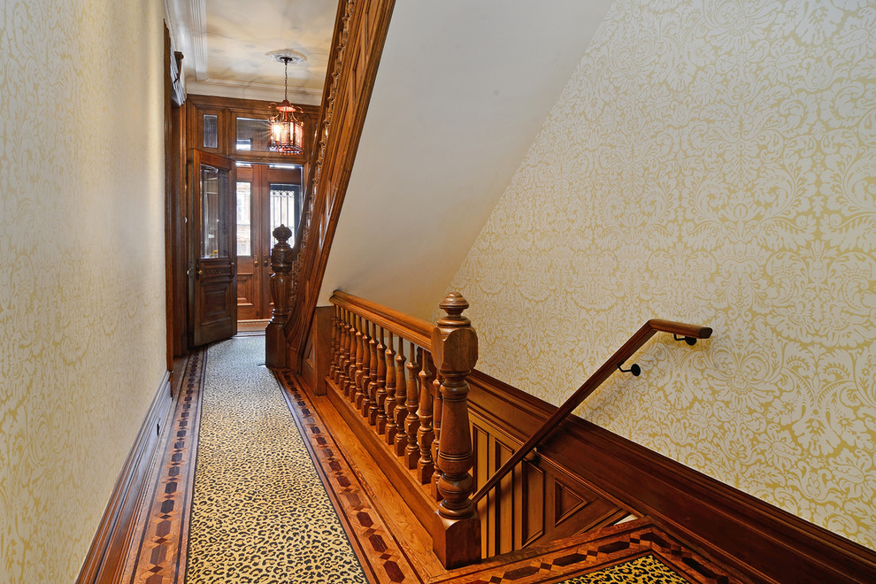 Inspiration for a timeless hallway remodel in New York with yellow walls