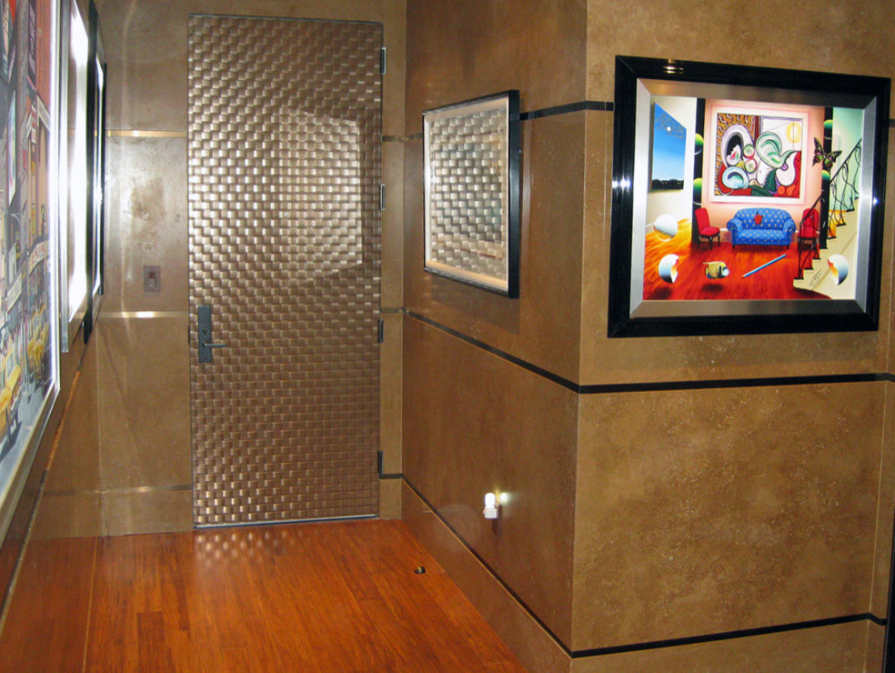 Hallway - mid-sized contemporary dark wood floor hallway idea in New York with beige walls