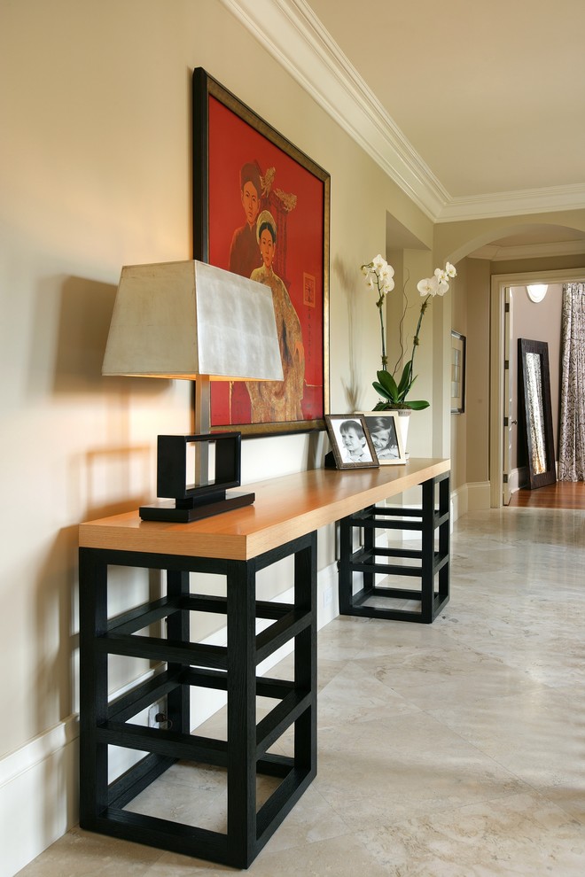 Hallway - contemporary gray floor hallway idea in Miami with beige walls