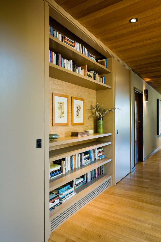 Inspiration for a large contemporary medium tone wood floor and yellow floor hallway remodel in San Francisco with beige walls