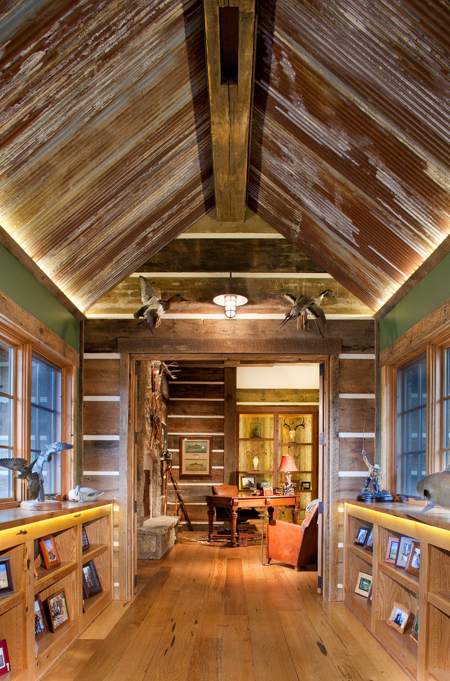 Hallway - rustic medium tone wood floor hallway idea in Denver with green walls
