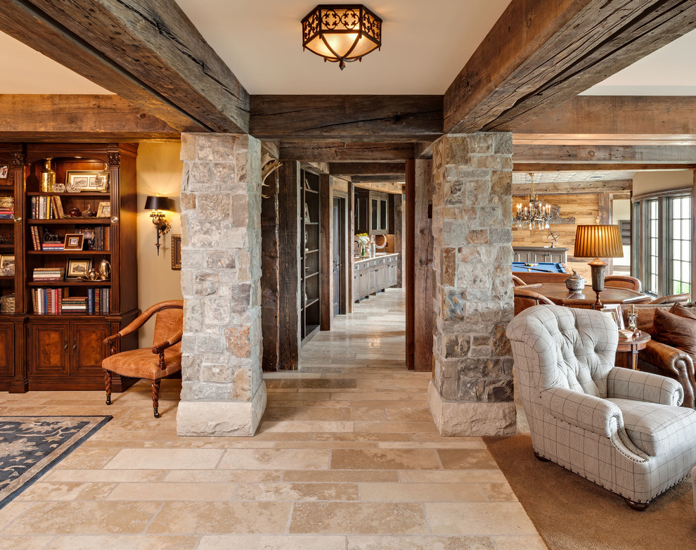 Example of a large classic travertine floor hallway design in Minneapolis with beige walls