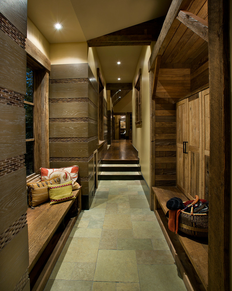 Hallway - large slate floor and gray floor hallway idea in Sacramento with brown walls