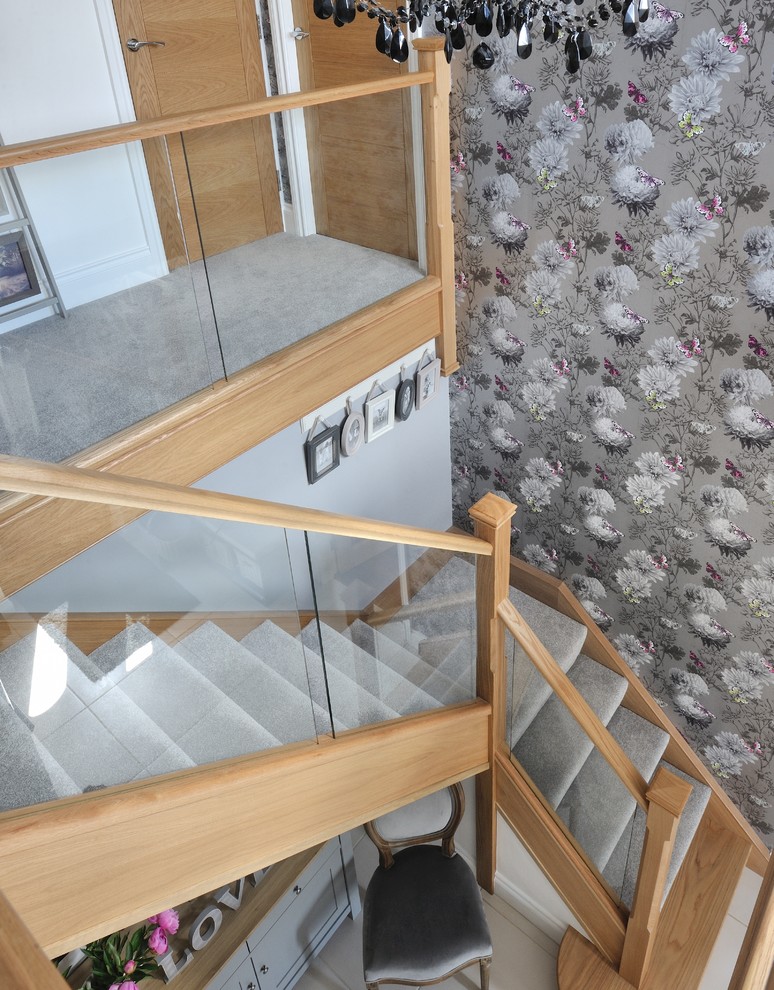 Mid-sized trendy carpeted l-shaped staircase photo in Other with wooden risers
