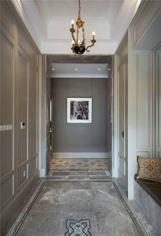 Inspiration for a small modern marble floor hallway remodel in Los Angeles with beige walls