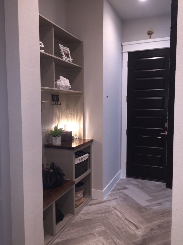 Mid-sized transitional porcelain tile and beige floor hallway photo with gray walls