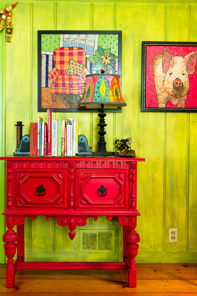 Inspiration for a farmhouse medium tone wood floor hallway remodel in New York with green walls