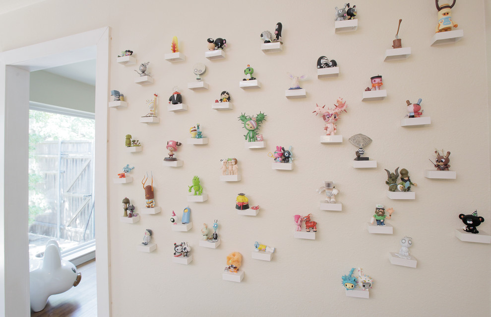 Eclectic hallway photo in Dallas with white walls