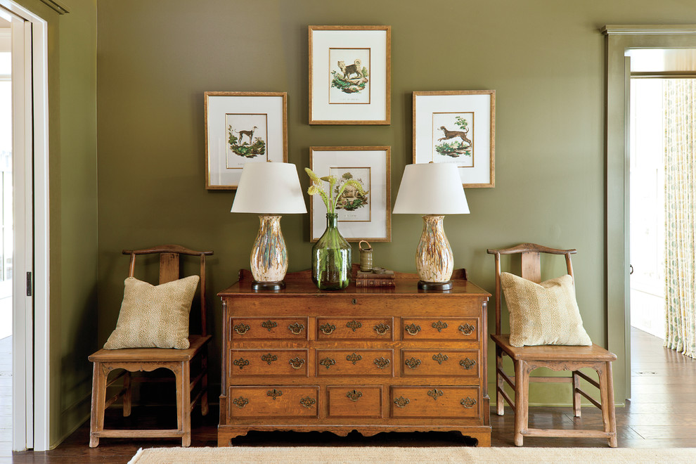 Example of a classic dark wood floor hallway design in Nashville with green walls