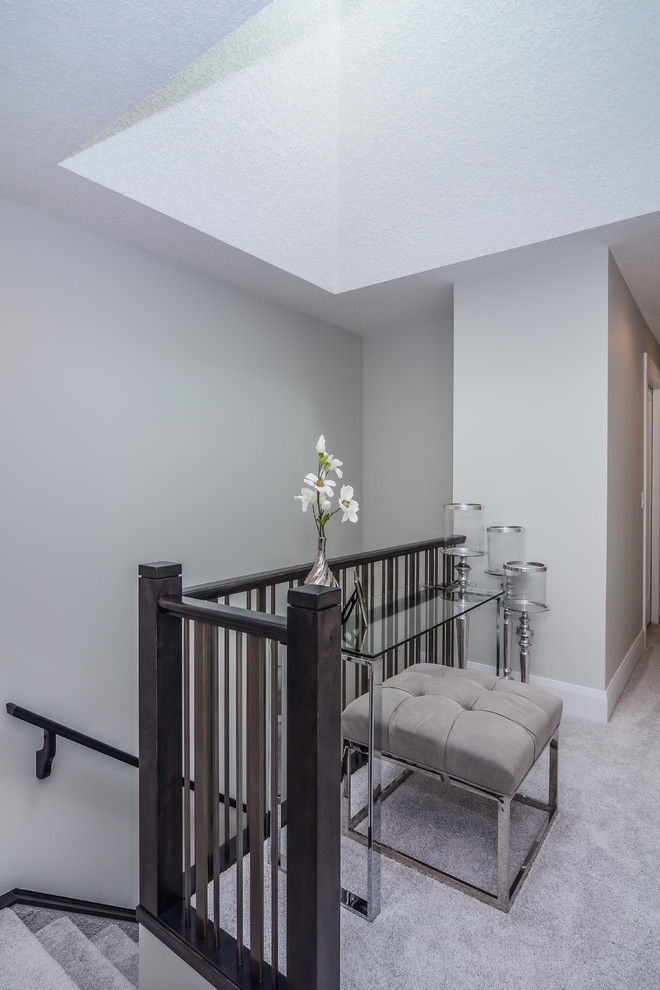 Inspiration for a small contemporary carpeted and gray floor hallway remodel in Calgary with gray walls