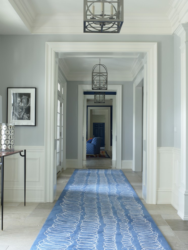 Transitional hallway photo in New York with gray walls