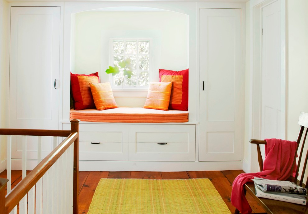 Inspiration for a farmhouse dark wood floor hallway remodel in New York with white walls