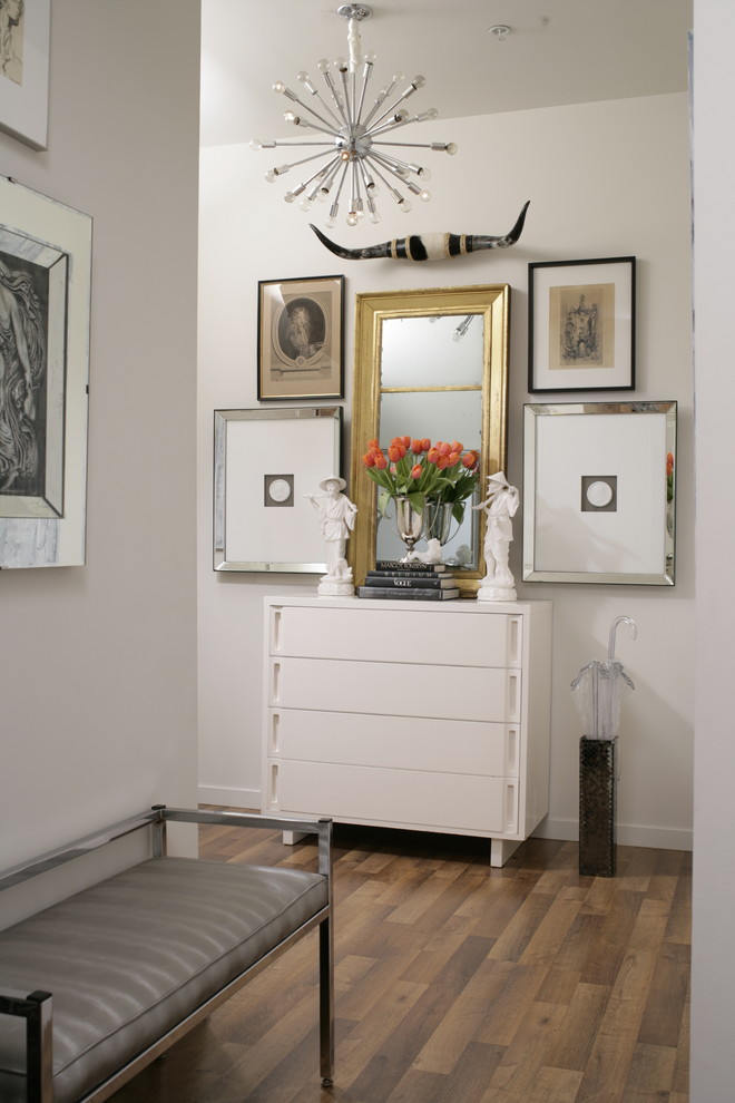 Example of a transitional hallway design in New York with white walls