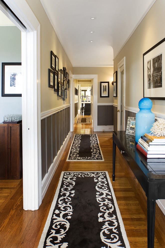 Inspiration for a timeless medium tone wood floor and brown floor hallway remodel in San Francisco with beige walls