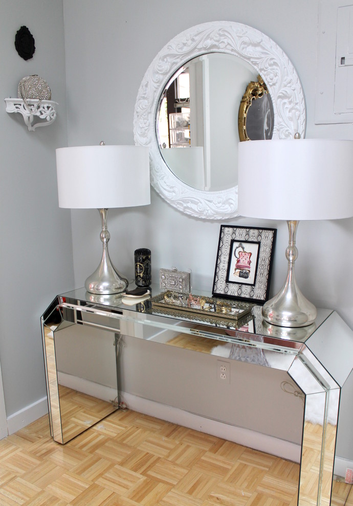 Hallway - small eclectic light wood floor hallway idea in Kansas City with gray walls