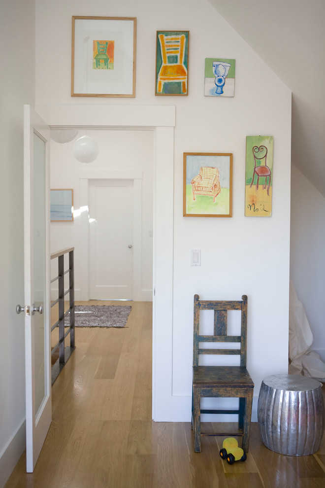 Inspiration for a contemporary light wood floor hallway remodel in San Francisco with white walls