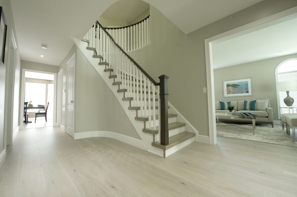Inspiration for a large contemporary laminate floor and gray floor hallway remodel in Toronto with gray walls