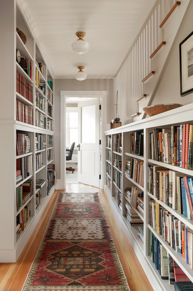 Hallway - coastal medium tone wood floor hallway idea in Portland Maine with white walls