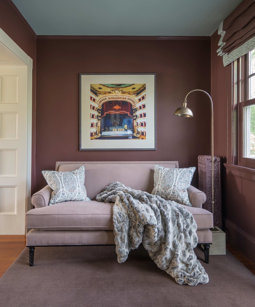 Small elegant medium tone wood floor hallway photo in Boston with brown walls