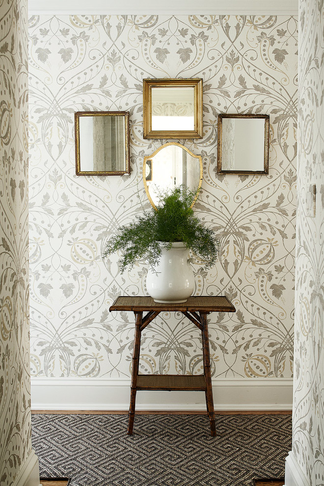 Inspiration for a timeless dark wood floor hallway remodel in New York with multicolored walls