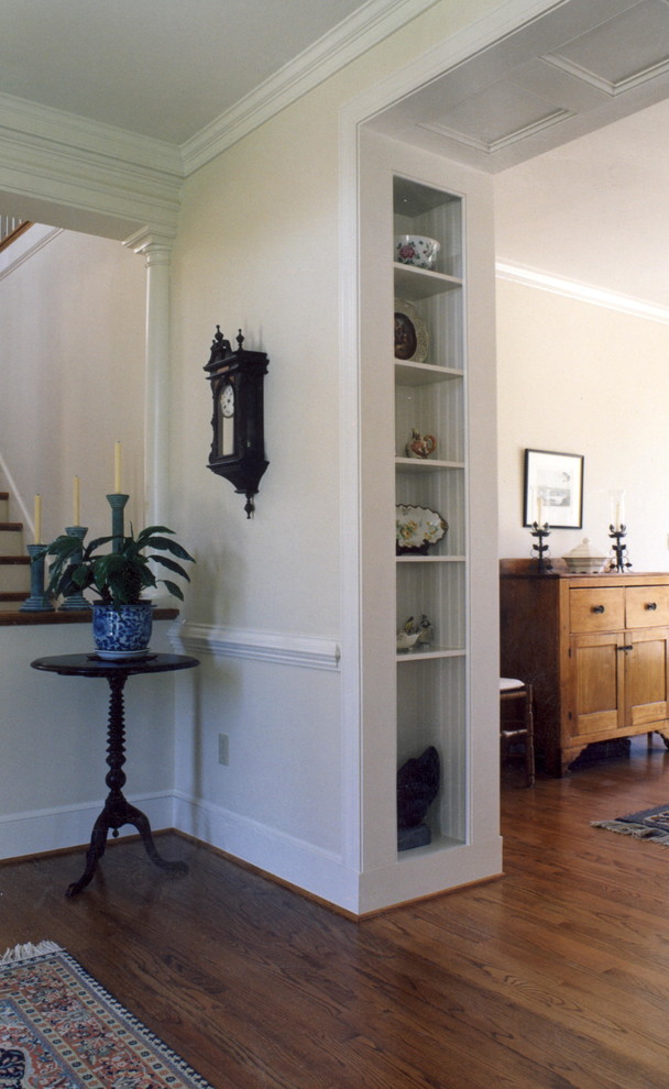 Hallway - traditional medium tone wood floor hallway idea in Other with white walls