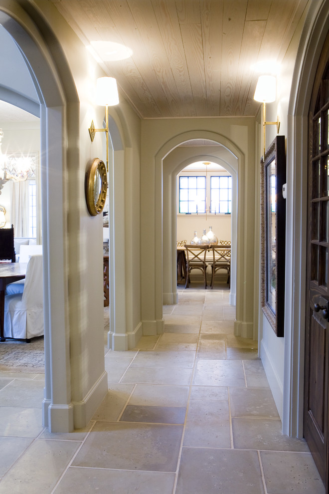 Example of a mid-sized trendy carpeted hallway design in Miami with beige walls
