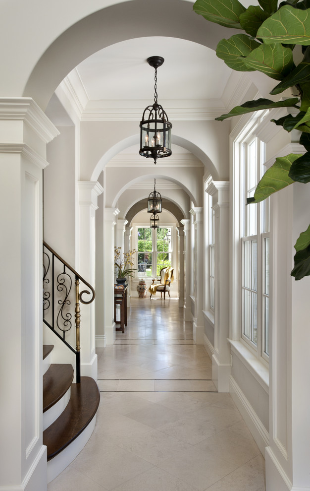 Elegant travertine floor hallway photo in San Francisco with white walls