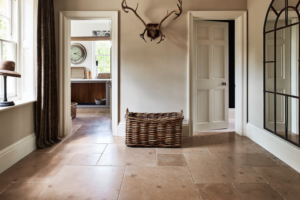 Hallway - contemporary limestone floor hallway idea in Wiltshire