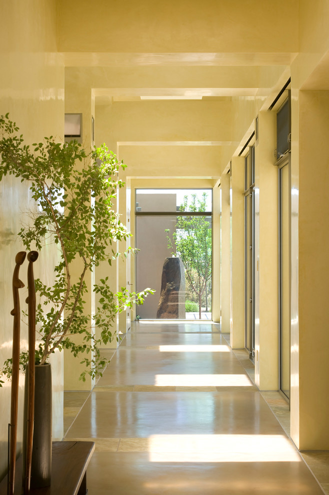 Example of a trendy hallway design in Albuquerque with beige walls