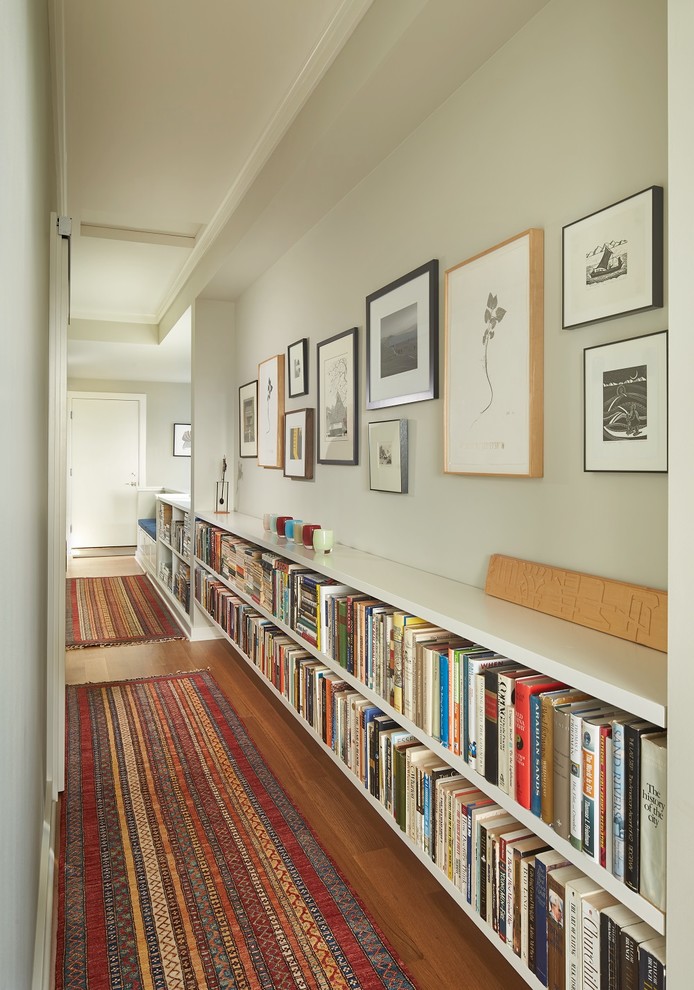 Small transitional medium tone wood floor hallway photo in Seattle with white walls