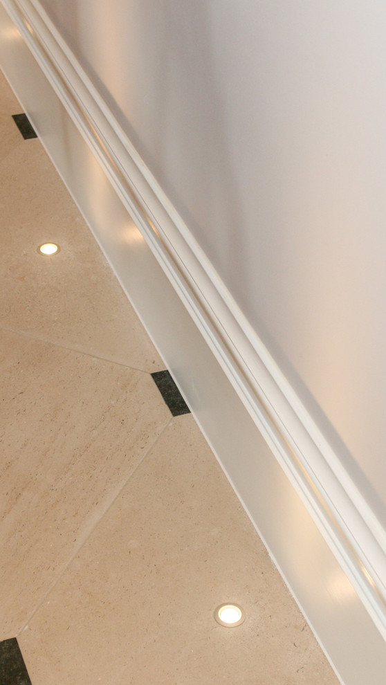 Recessed uplights in traditional stone floor Traditional Hall