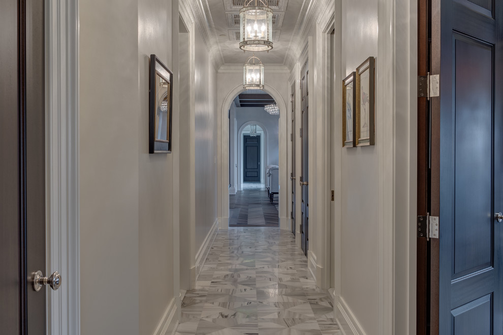 Mid-sized elegant marble floor hallway photo in Philadelphia with white walls
