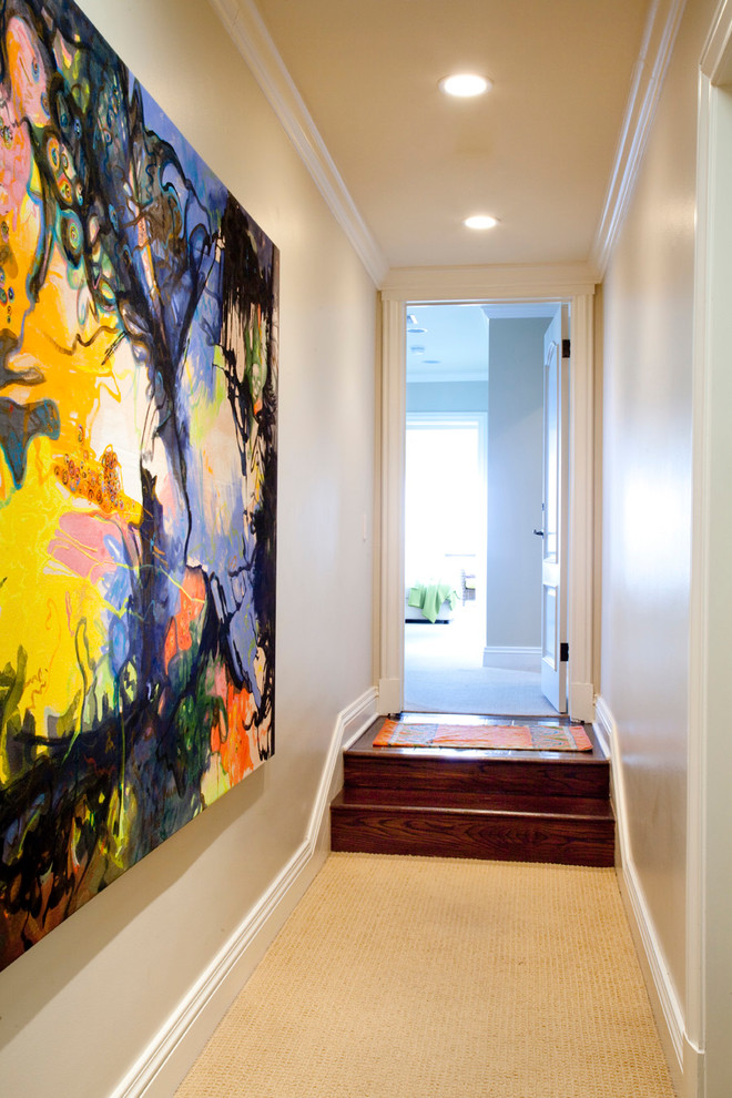 Trendy carpeted hallway photo in Los Angeles with beige walls