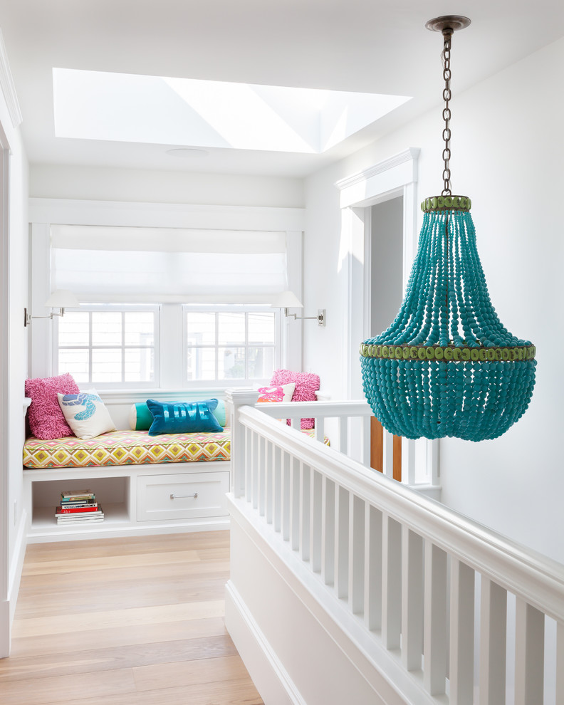 Hallway - coastal medium tone wood floor hallway idea in Boston with white walls