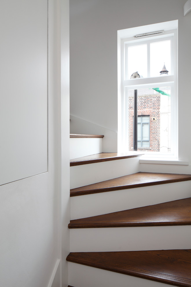 Inspiration for a small contemporary wood staircase in London.