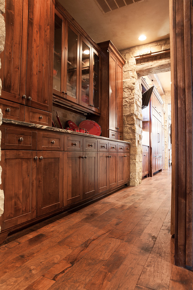 Mountain style dark wood floor hallway photo in Austin