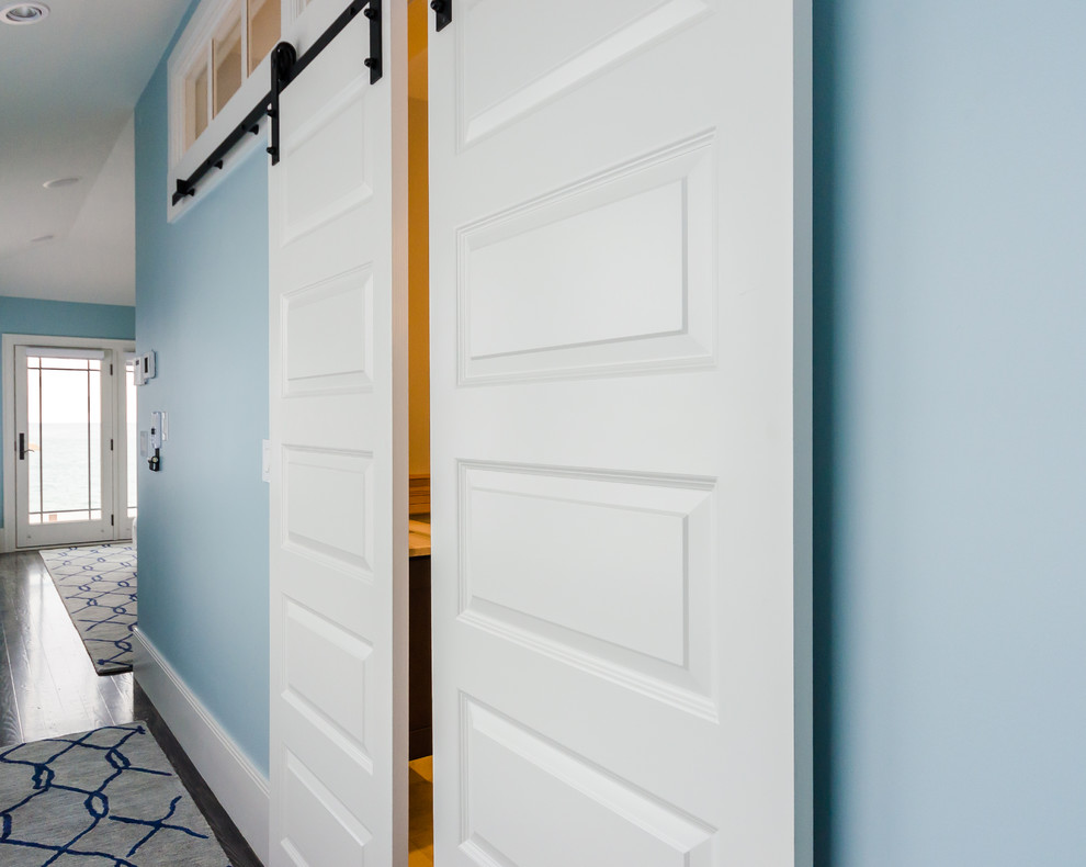Example of a mid-sized beach style hallway design in Boston with blue walls