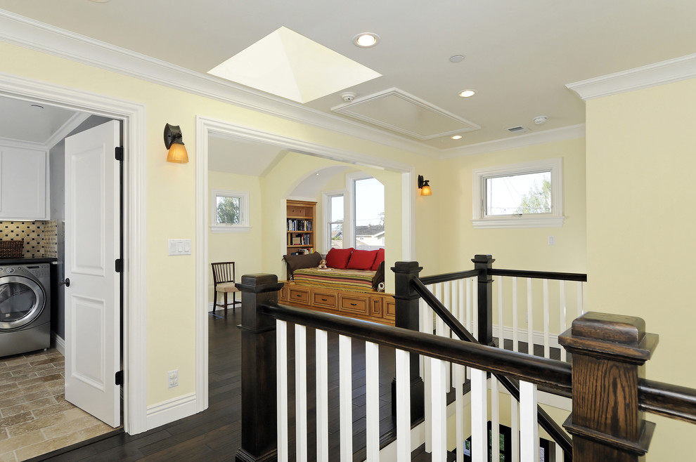 Inspiration for a craftsman dark wood floor hallway remodel in San Francisco with yellow walls