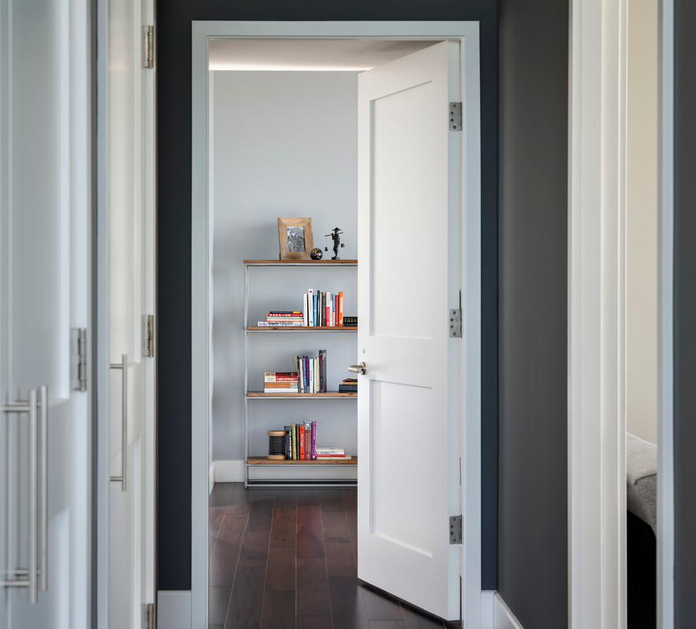 Example of a small minimalist dark wood floor hallway design in San Francisco with gray walls
