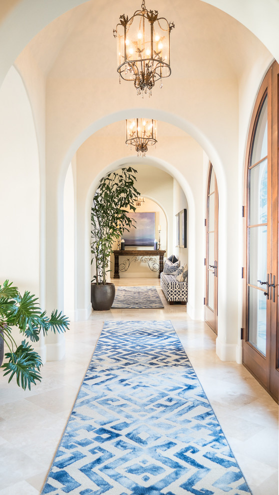 Large transitional ceramic tile and beige floor hallway photo in San Diego with white walls