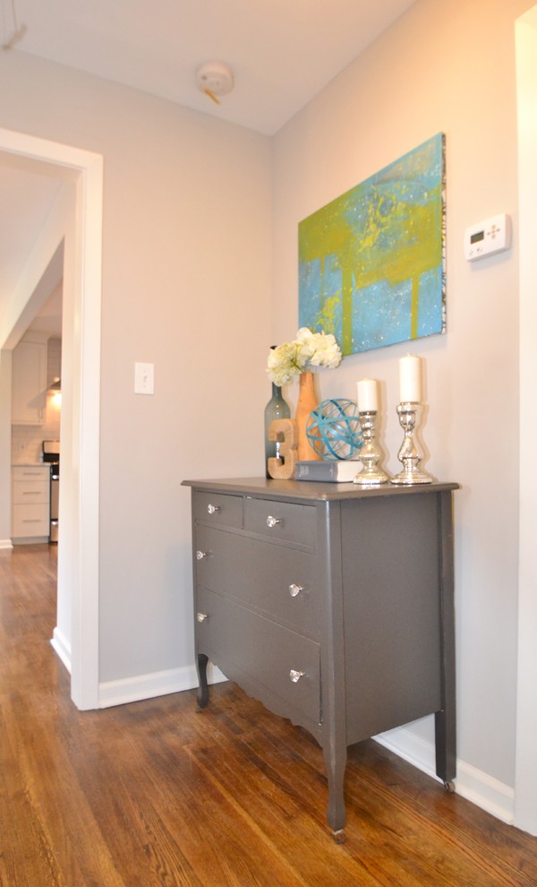 Mid-sized trendy light wood floor hallway photo in Charlotte with gray walls